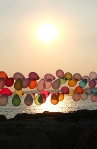 balloons against sunset